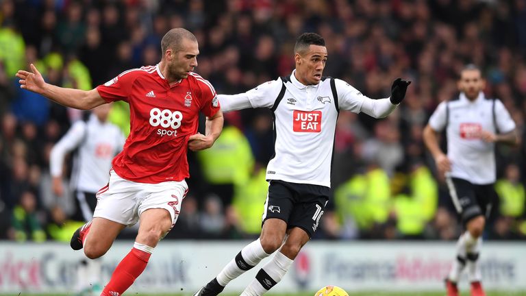 Tom Ince (R) and Pajtim Kasami battle for possession during a Sky Bet Championship match on December 11, 2016