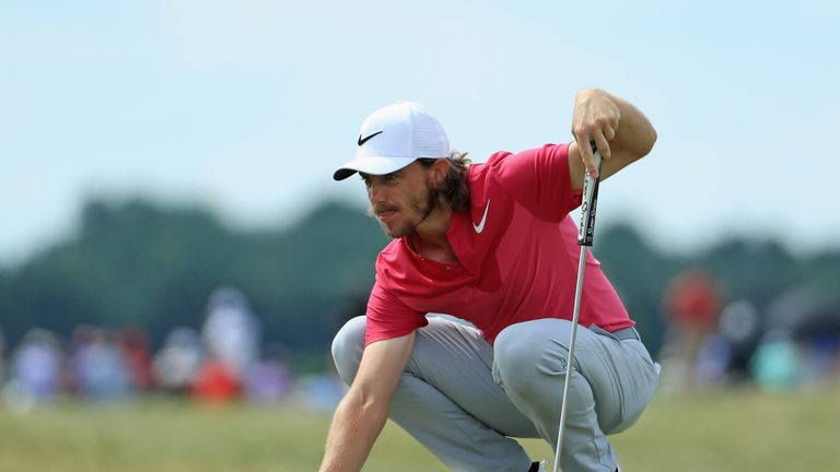 Tommy Fleetwood lines up a putt on the sixth green