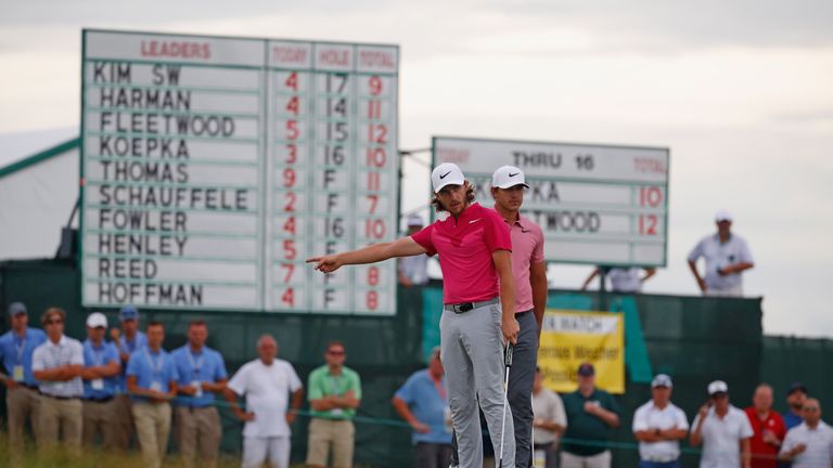 HARTFORD, WI - JUNE 17:  Tommy Fleetwood of England reacts on the 17th green as Brooks Koepka of the United States looks on during the third round of the 2