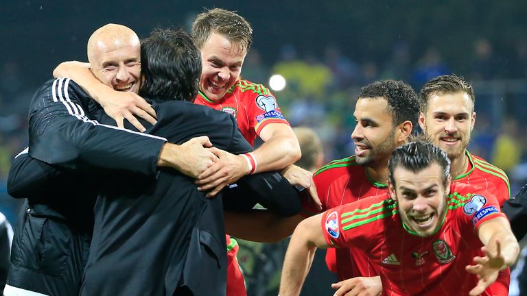 Head coach Chris Coleman (L) of Wales celebrate with the Chris Gunter (C) and Gareth Bale (R) 