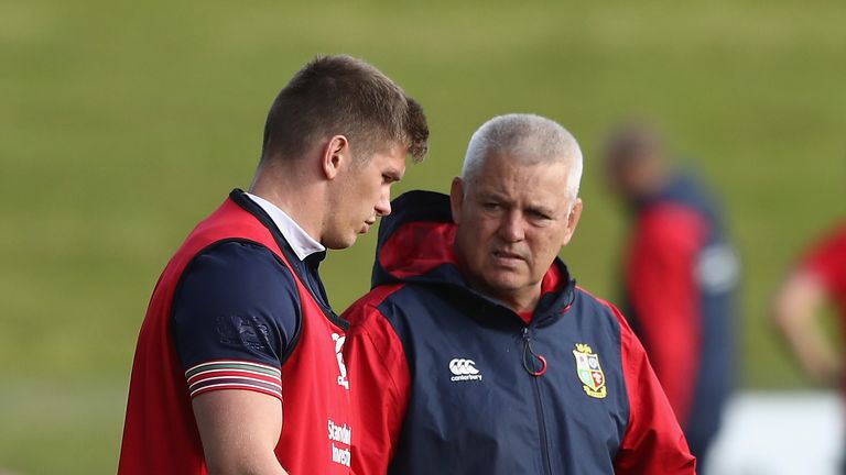 Warren Gatland (R) the Lions head coach talks to Owen Farrell during a British & Irish Lions training session