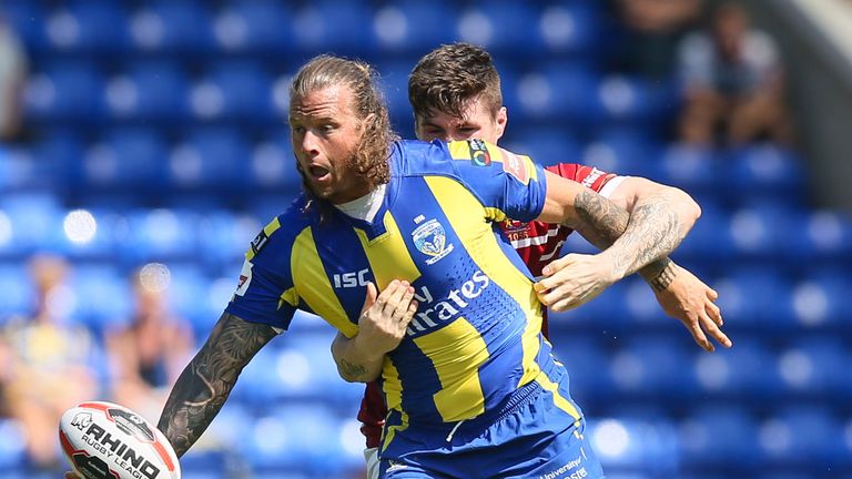 Ashton Sims is tackled by John Bateman