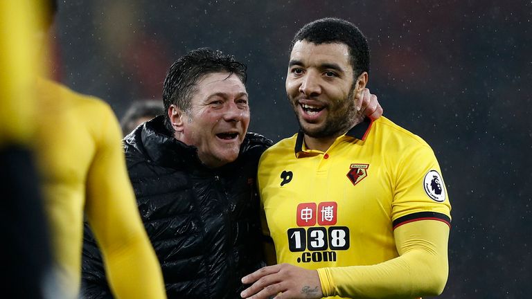 Watford's Italian head coach Walter Mazzarri (L) celebrates with Watford's English striker Troy Deeney following the English Premier League football match 