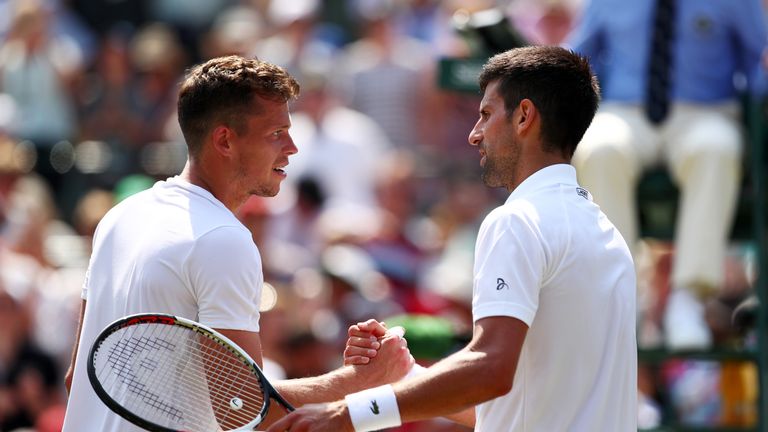 LONDON, ENGLAND - JULY 06:  Novak Djokovic of Serbia and Adam Pavlasek of the Czech Republic shake hands after their Gentlemen's Singles second round match