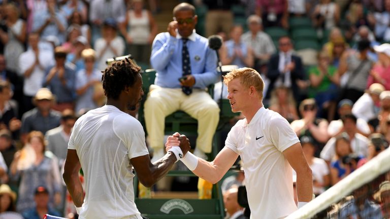 LONDON, ENGLAND - JULY 06:  Gael Monfils of France and Kyle Edmund of Great Britain shake hands after their Gentlemen's Singles second round match on day f
