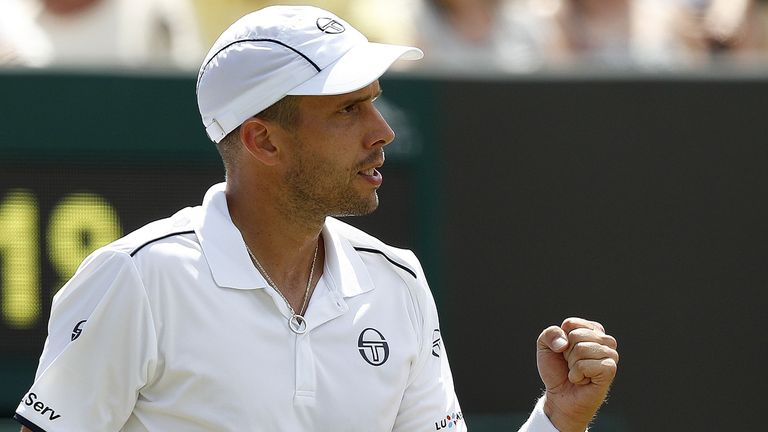 Luxembourg's Gilles Muller celebrates winning the second set against Britain's Aljaz Bedene during their men's singles third round match on the fifth day o