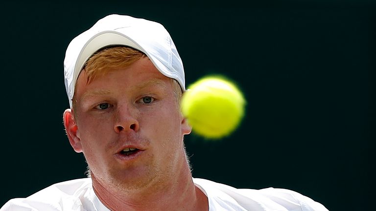 Britain's Kyle Edmund returns against France's Gael Monfils during their men's singles second round match on the fourth day of the 2017 Wimbledon Champions