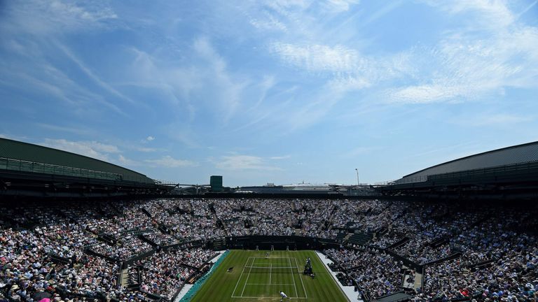 Adam Pavlasek serves to Serbia's Novak Djokovic during their men's singles second round match on the fourth day of the 2017 Wimbledon Championships