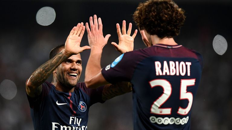 Paris Saint-Germain's French midfielder Adrien Rabiot (R) is congratuled by Paris Saint-Germain's Brazilian defender Dani Alves after scoring a goal during