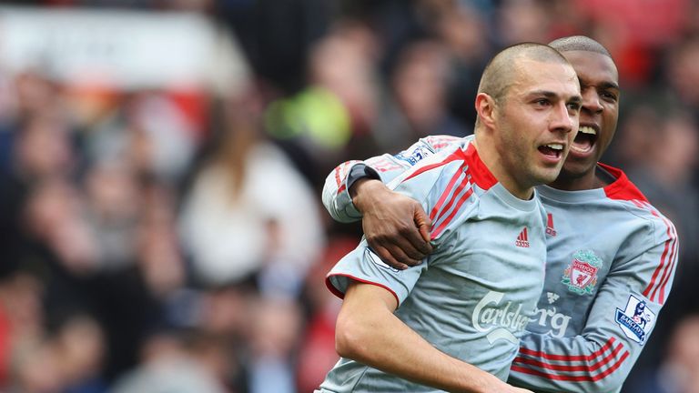 MANCHESTER, ENGLAND - MARCH 14: Andrea Dossena of Liverpool celebrates scoring their fourth goal during the 