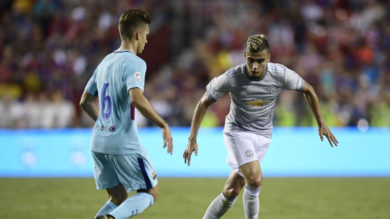 Denis Suárez (L) of Barcelona and Andreas Pereira of Manchester United vie for the ball