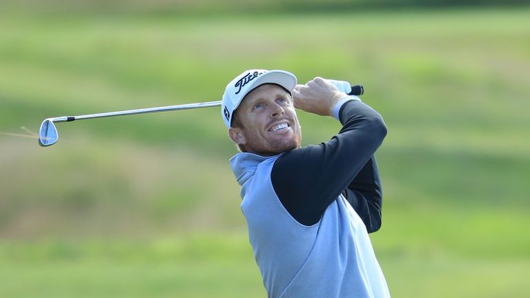 Andrew Dodt of Australia hits his second shot on the 9th hole during the final round of the AAM Scottish Open at Dundonald Links