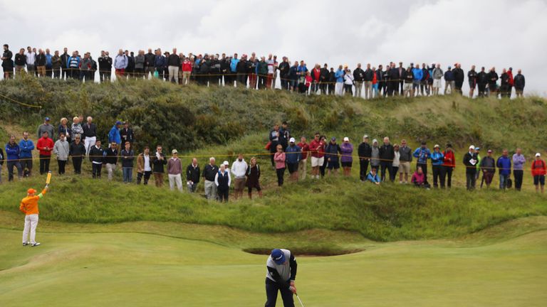 Andrew Johnston of England putts on the 2nd green during the first round of The Open