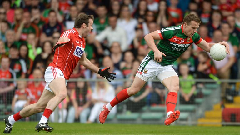 Andy Moran of Mayo gets past James Loughrey of Cork during the GAA Football All-Ireland Senior Championship Round 4A match between Cork and Mayo