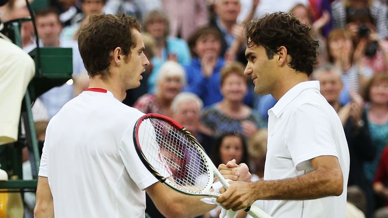 LONDON, ENGLAND - JULY 08:  Roger Federer of Switzerland (R) shakes hands with  Andy Murray of Great Britain after defeating him 