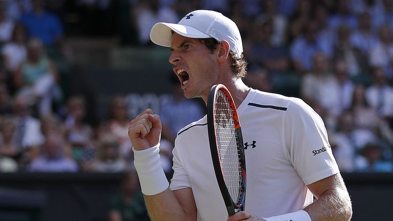 Britain's Andy Murray reacts after breaking Germany's Dustin Brown's serve during their men's singles second round match on the third day of the 2017 Wimbl