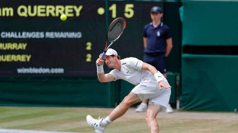 Britain's Andy Murray returns against US player Sam Querrey during their men's singles quarter-final match on the ninth day of the 2017 Wimbledon Champions