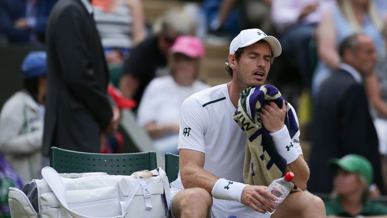 Britain's Andy Murray reacts as he sits in the break between games against US player Sam Querrey in their men's singles quarter-final match on the ninth da