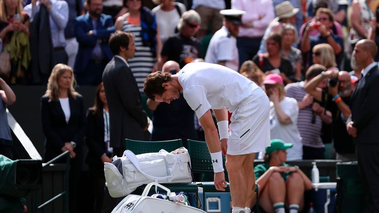 Britain's Andy Murray collects his things after losing against US player Sam Querrey in their men's singles quarter-final match on the ninth day of the 201