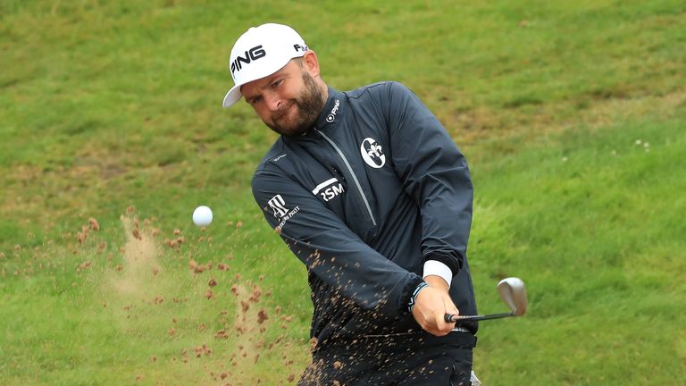 Andy Sullivan splashes out of a bunker to hole his third shot for an eagle at the 18th in the third round of the Scottish Open