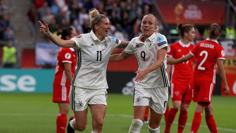 Anja Mittag and Mandy Islacker celebrate a goal for Germany