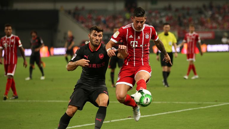 SHANGHAI, CHINA - JULY 19:  Sead Kolasinac of Arsenal FC of Arsenal FC competes for the ball with Rafinha of FC Bayern during the 2017 International Champi