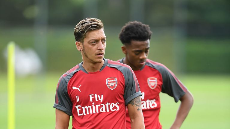 Mesut Ozil looks on during a training session at London Colney