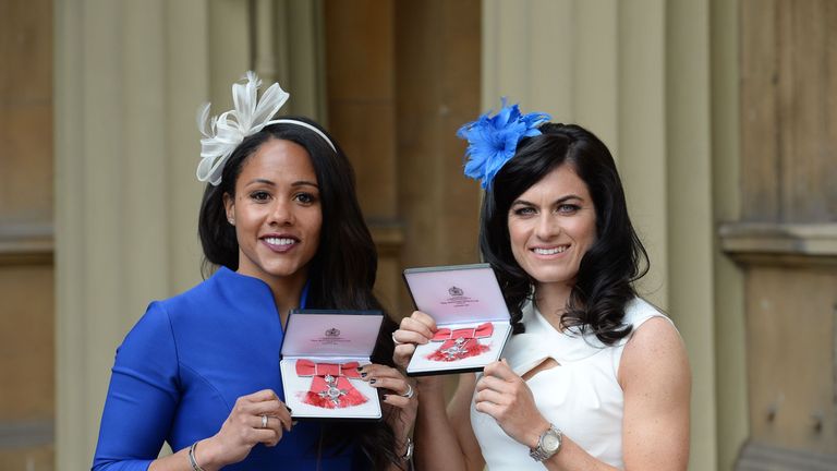 Arsenal Ladies and England Women footballer Alexandra Scott (L) and Chelsea Ladies and England women footballer Karen Carney (R) pose with their medals