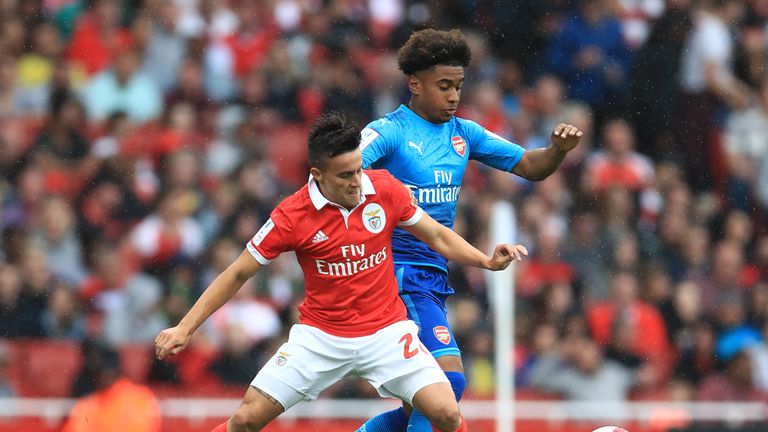 Benfica's Franco Cervi (left) and Arsenal's Reiss Nelson battle for the ball during the Emirates Cup match