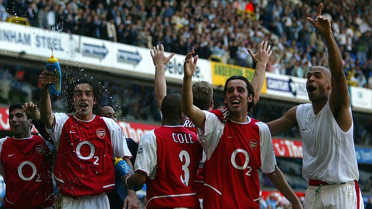 LONDON, UNITED KINGDOM:  Arsenal's L to R facing camera Jose Antonio Reyes,Robert Pires,Edu and Thierry Henry celebrates winning the 2003/2004 Football Pre