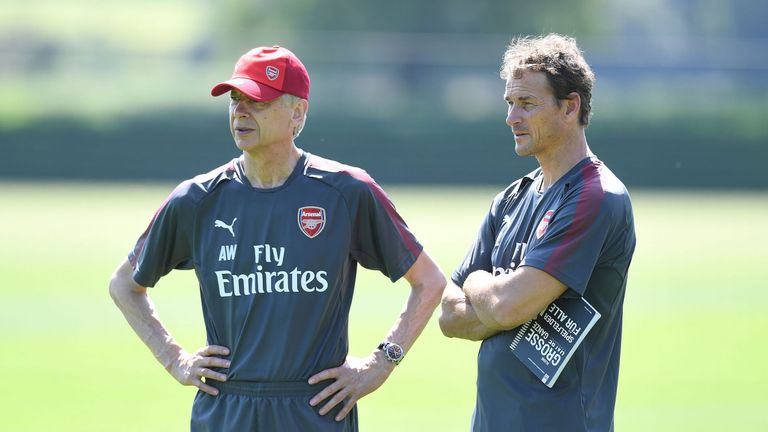 Arsene Wenger and first-team coach Jens Lehmann oversee training at London Colney