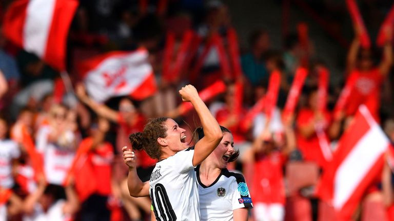 Austria's Nina Burger (L) celebrates after scoring