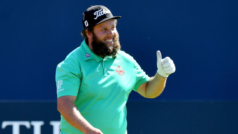 Andrew Johnston of England gives a thumbs up to the crowd on the 1st hole during a practice round prior to the 146th Open Championship