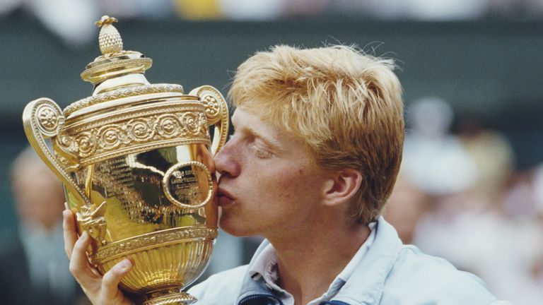 Boris Becker of Germany kisses the Gentleman's trophy to celebrate his victory over Kevin Curren 6-3, 6-7 (4-7), 7-6 (7-3), 6-4 during the Men's Singles fi