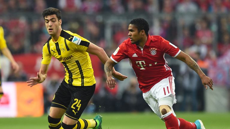 Mikel Merino (L) and Douglas Costa in action during the Bundesliga match between Bayern Munich and Bourssia Dortmund