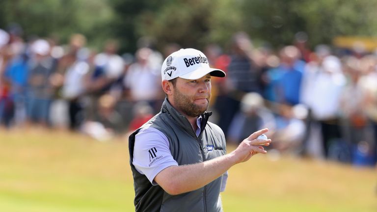 Branden Grace of South Africa acknowledges the crowd during the final round of The 146th Open 