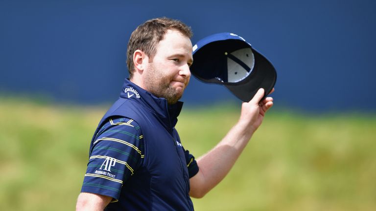 Branden Grace of South Africa acknowledges the crowd on the 18th green after shooting a 62, the lowest round in major history, at The 146th Open