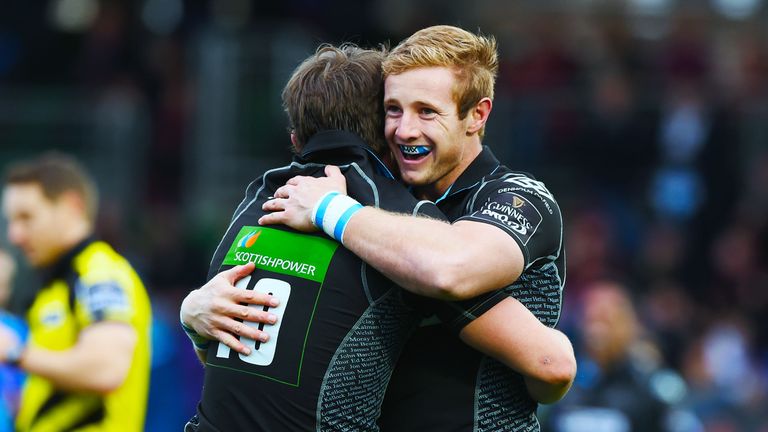 Warriors Peter Horne celebrates with teammate Brandon Thomson (R) after he touches down his side's seventh try