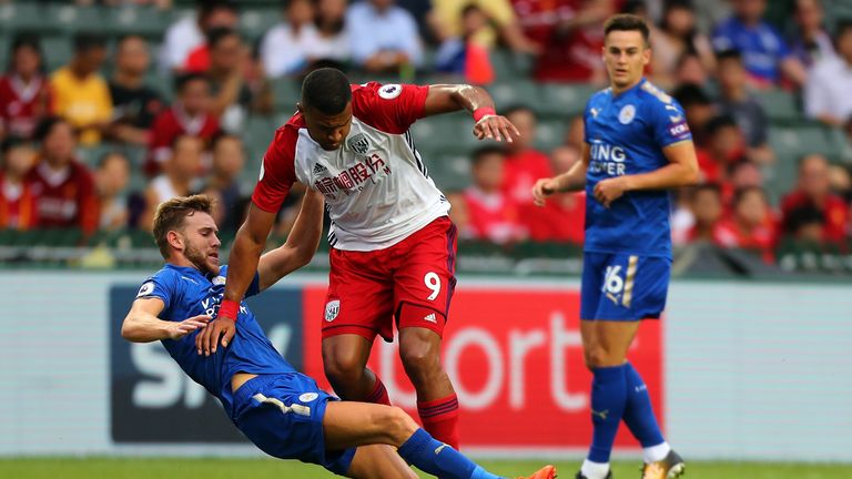 Salomon Rondon is challenged by Callum Elder during the first half 