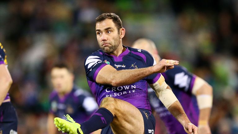 CANBERRA, AUSTRALIA - JULY 22: Cameron Smith of the Storm kicks ahead during the round 20 NRL match between the Canberra Raiders and the Melbourne Storm at