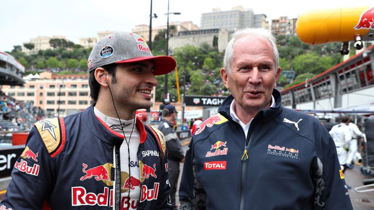 MONTE-CARLO, MONACO - MAY 29: Carlos Sainz of Spain and Scuderia Toro Rosso talks to Red Bull Racing Team Consultant Dr Helmut Marko ahead of the Monaco Fo
