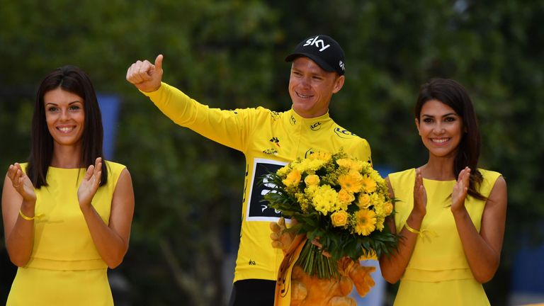 Tour de France 2017's winner Great Britain's Christopher Froome celebrates his overall leader yellow jersey on the podium at the end of final stage