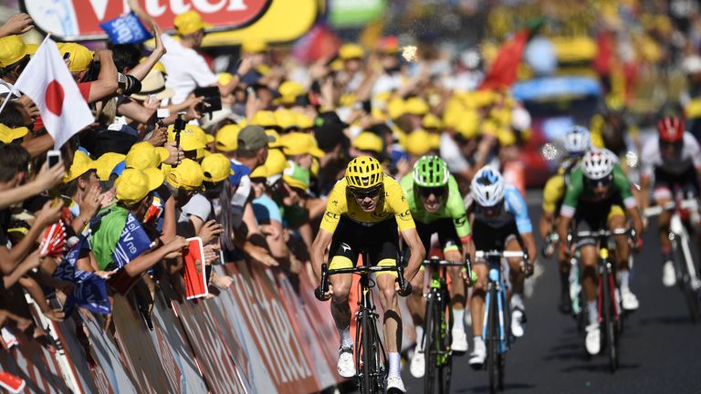 Chris Froome sprints to the line ahead of his rivals after a dramatic stage 15