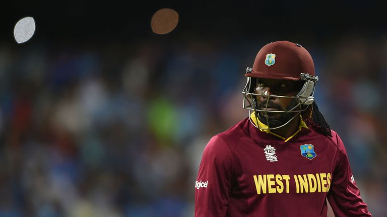 West Indies's Chris Gayle walks back to the pavilion after his dismissal during the World T20 semi-final match between India and West Indies at The Wankhed