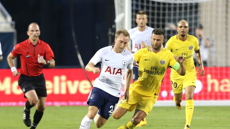 Christian Eriksen #23 of Tottenham Hotspur and Thiago Motta #8 of Paris Saint-Germain chase the ball during the International Champions Cup clash