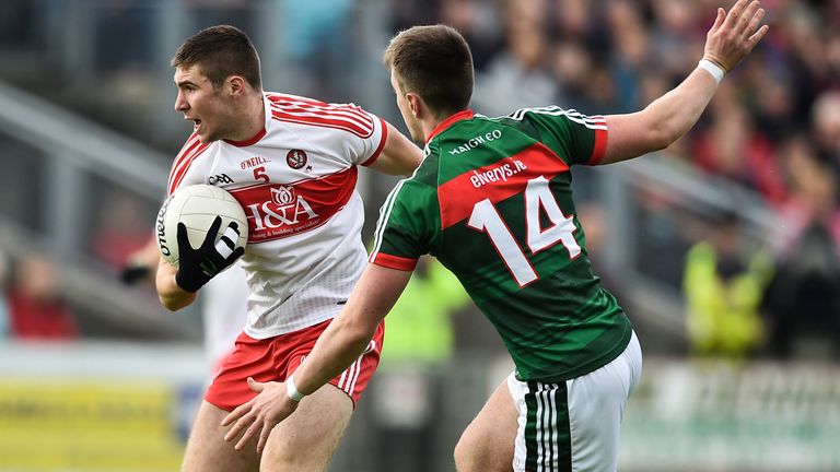 Ciaran McFaul of Derry in action against Cillian O'Connor of Mayo during the GAA Football All-Ireland Senior Championship Round 2A match