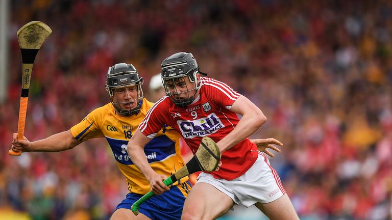 Darragh Fitzgibbon of Cork in action against David Reidy of Clare 