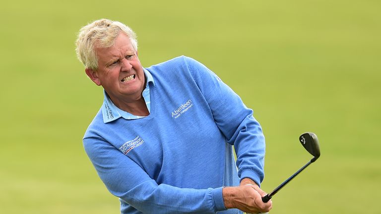 BRIDGEND, WALES - JULY 27:   Colin Montgomerie of Scotland hits an approach shot during the first round of the the Senior Open Championship presented by Ro