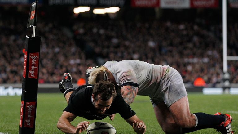 AUCKLAND, NEW ZEALAND - JUNE 07:  Conrad Smith of the All Blacks scores a try in the tackle of Joe Marler of England during the International Test Match be