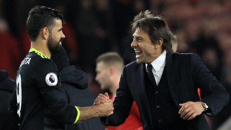 Chelsea's Italian head coach Antonio Conte (R) reacts as he congratulates Chelsea's Brazilian-born Spanish striker Diego Costa following the English Premie